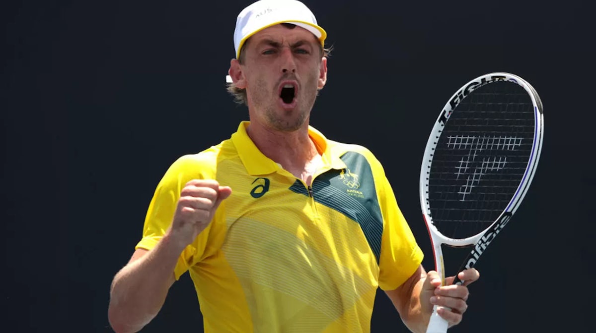 John Millman of Team Australia plays a forehand during his Men's Singles First Round match against Lorenzo Musetti of Team Italy on day one of the Tokyo 2020 Olympic Games at Ariake Tennis Park