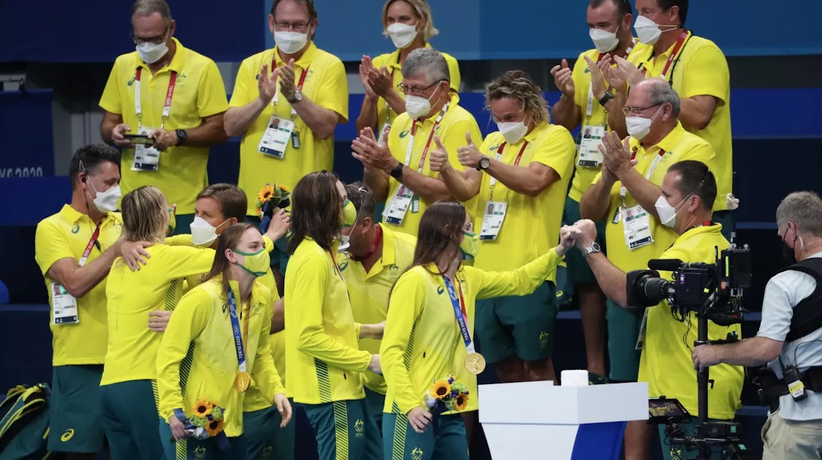 Gold medalist Kaylee McKeown, Chelsea Hodges, Emma McKeon and Cate Campbell of Team Australia celebrate with Team Australia members after the medal ceremony for the Women's 4 x 100m Medley Relay