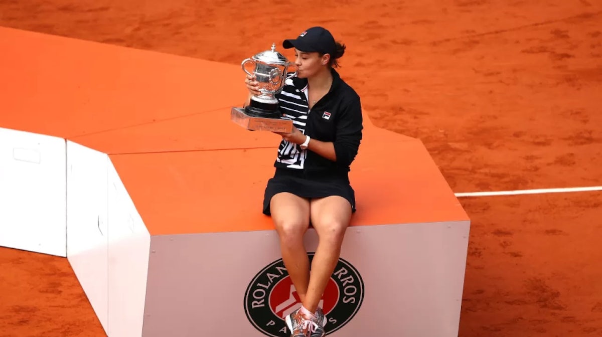 Ashleigh Barty of Australia kisses the trophy as she celebrates victory following the ladies singles final against Marketa Vondrousova of The Czech Republic during Day fourteen of the 2019 French Open at Roland Garros 