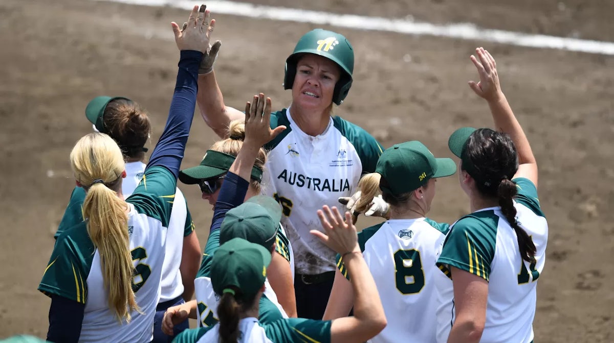 Stacey Anne Porter #16 of Australia celebrates with teammates after scoring a run on a ball hit by Jade Rosalind Wall #1 in the fifth inning against Italy during the Preliminary Round match at NASPA Stadium on day three of the WBSC Women's Softball World 