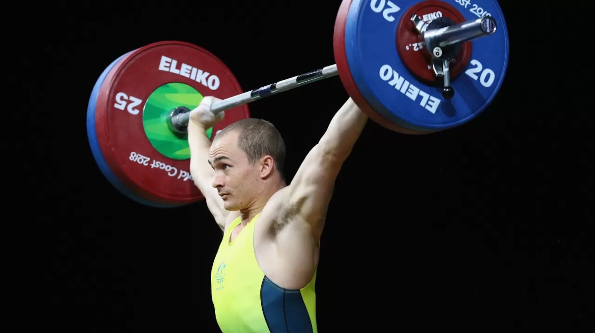 GOLD COAST, AUSTRALIA - APRIL 06: Brandon Wakeling of Australia competes in the snatch discipline during the Men's 69kg Weightlifting on day two of the Gold Coast 2018 Commonwealth Games at Carrara Sports and Leisure Centre on April 6, 2018 on the Gold Co