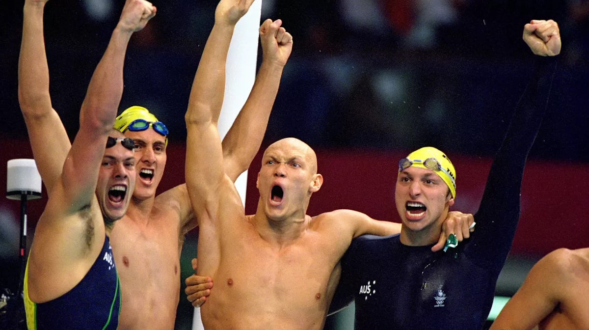 Ashley Callus, Chris Fydler, Michael Klim and Ian Thorpe of Australia celebrate after winning Gold in the Mens 4 x 100m Freestyle Relay at the Sydney International Aquatic Centre during Day One of the Sydney 2000 Olympic Games in Sydney, Australia. They w