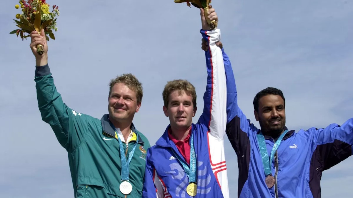 Gold Medalist Richard Faulds of Great Britain (centre), silver medalist Russell Mark of Austraila (left) and bronze medalist Fehaid Al Deehani of Kuwait after the mens double trap qualification during the Sydney 2000 Olympic Games at the Sydney Internatio