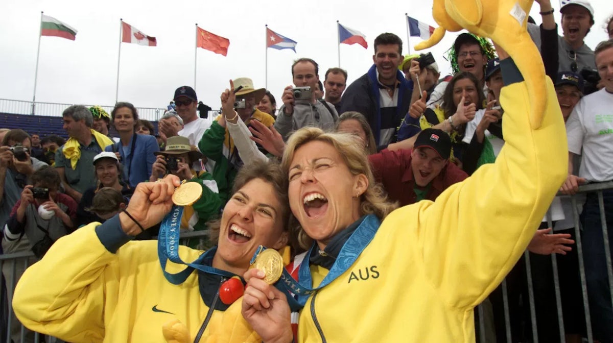 Natalie Cook and Kerri Pottharst of Australia celebrate after their win over Brazil to win the Gold medal, in the final of the Women's Beach Volleyball at the Sydney 2000 Olympic Games, held at the Beach Volleyball Centre in Bondi, Sydney,Australia. DIGIT
