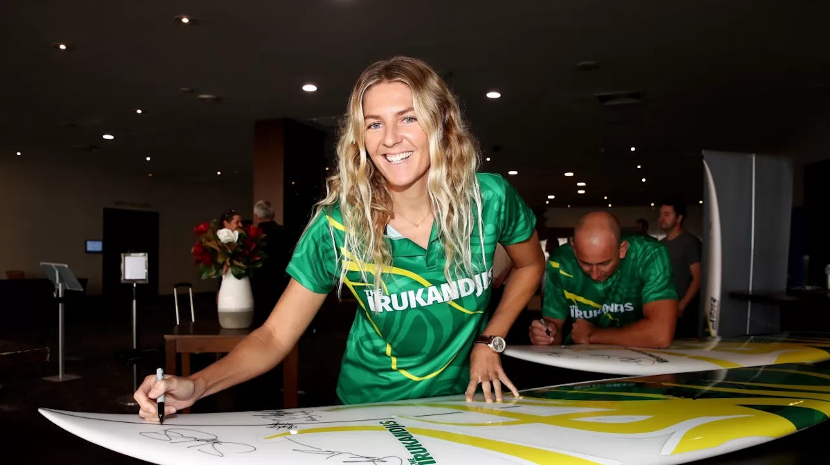 SYDNEY, AUSTRALIA - MARCH 17: Australian surfer Stephanie Gilmore signs a surfboard during the Team Australia Surfing launch and 'The Irukandjis' naming during a Surfing Australia media announcement at Novotel Sydney Manly Pacific on March 17, 2021 in Syd