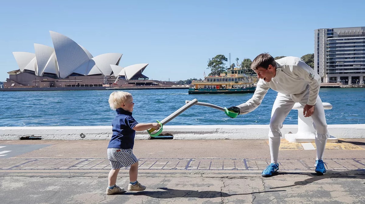 Edward Fernon plays with his son Lachlan during the Australian Olympic Committee 'Olympics Live' announcement at Tallawoladah Lawn on April 14, 2021 in Sydney, Australia