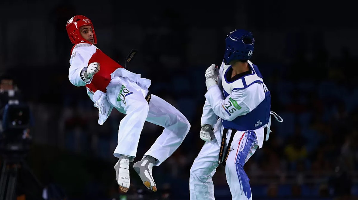 Safwan Khalil of Australia kicks Tawin Hanprab of Thailand during the Taekwondo Men's -58kg Quarter Final contest at Cairoca Arena 3 on August 18, 2016 in Rio de Janeiro, Brazil.