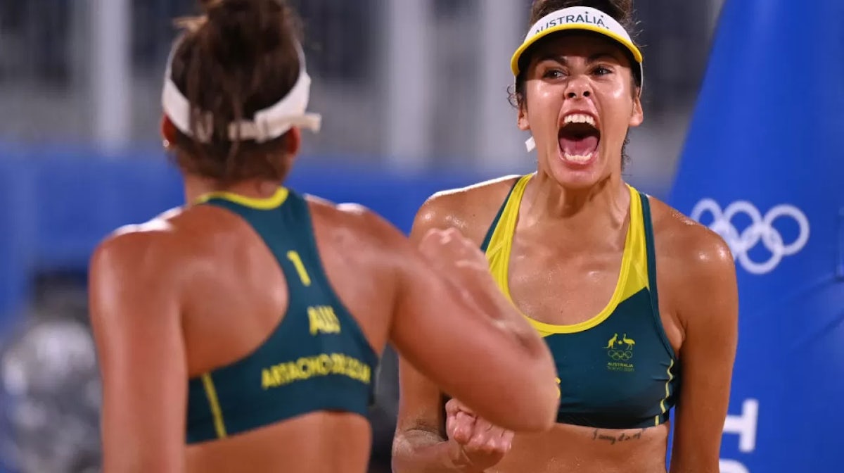 Taliqua Clancy (R) reacts in front of partner Mariafe Artacho del Solar in their women's beach volleyball quarter-final match between Canada and Australia during the Tokyo 2020 Olympic