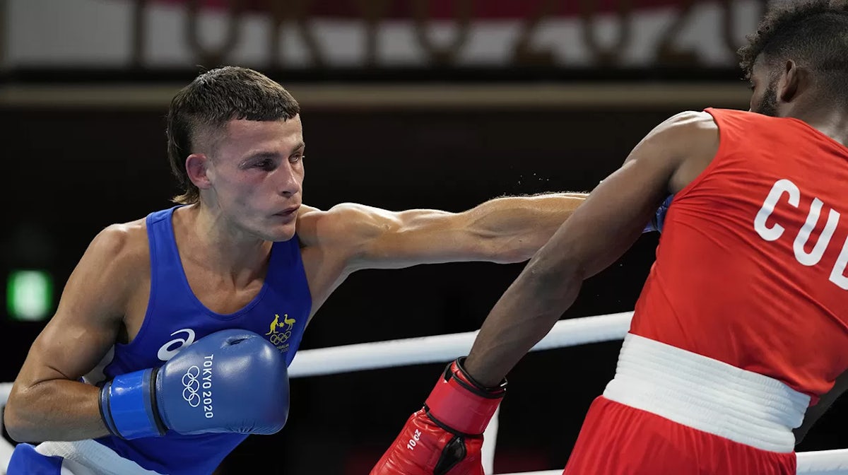 Australia's Harry Garside (L) punches Cuba's Andy Cruz during their men's lightweight 63-kg boxing match at the 2020 Summer Olympics on August 6, 2021, in Tokyo, Japan. (Photo by Themba Hadebe