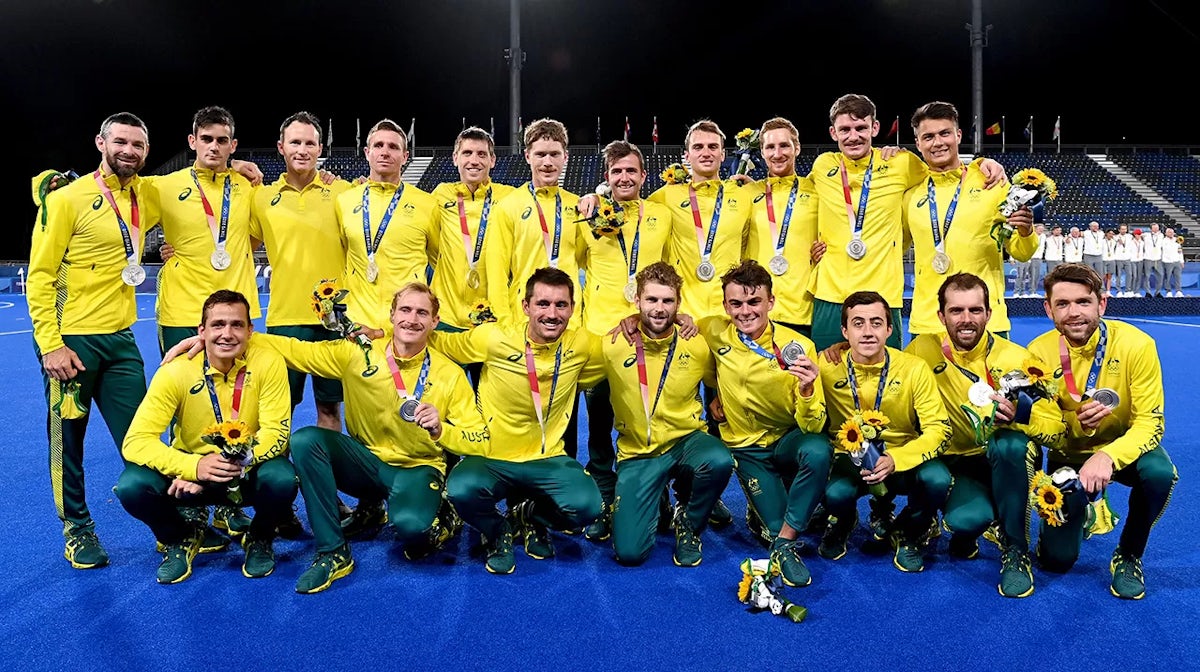 The Australian team poses for a photo after the gold medal final match between Australia and Belgium on day thirteen of the Tokyo 2020 Olympic Games at Oi Hockey Stadium on August 05, 2021 in Tokyo, Japan