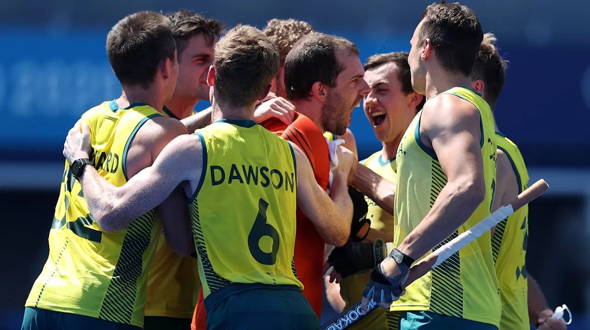 Andrew Lewis Charter and Matthew Dawson of Team Australia and teammates celebrate after winning the penalty shootout after the Men's Quarterfinal match between Australia and Netherlands on day nine of the Tokyo 2020 Olympic Games at Oi Hockey Stadium on A