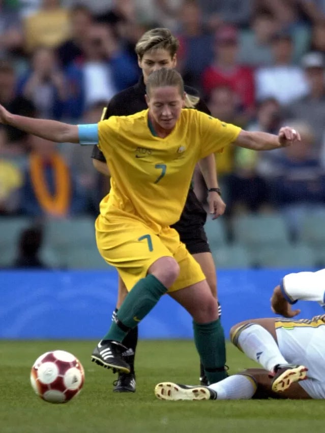 Alison Forman of Australia in action as Jane Toernqvist of Sweden falls to the ground in the match between Australia and Sweden during the Sydney 2000 Olympic Games, held at the Sydney Football Stadium in Sydney, Australia. DIGITAL IMAGE Mandatory Credit: